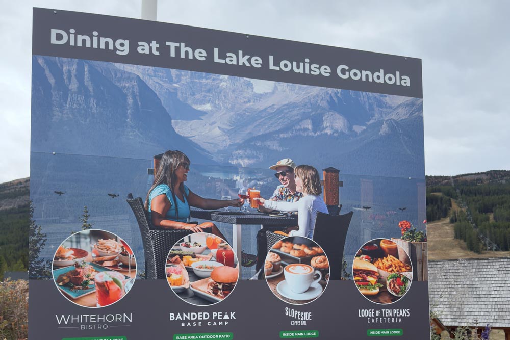 Poster and outdoor signage featuring the Whitehorn Bistro dining photo outside resort lodges.